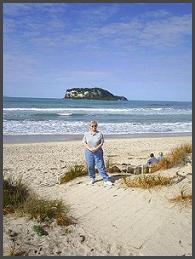 Sandy on Whangamata Beach with Hatura (Clark) Island in background